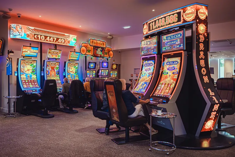 Row of colourful slot machines at Casino JOA César Palace de Saint-Paul-lès-Dax