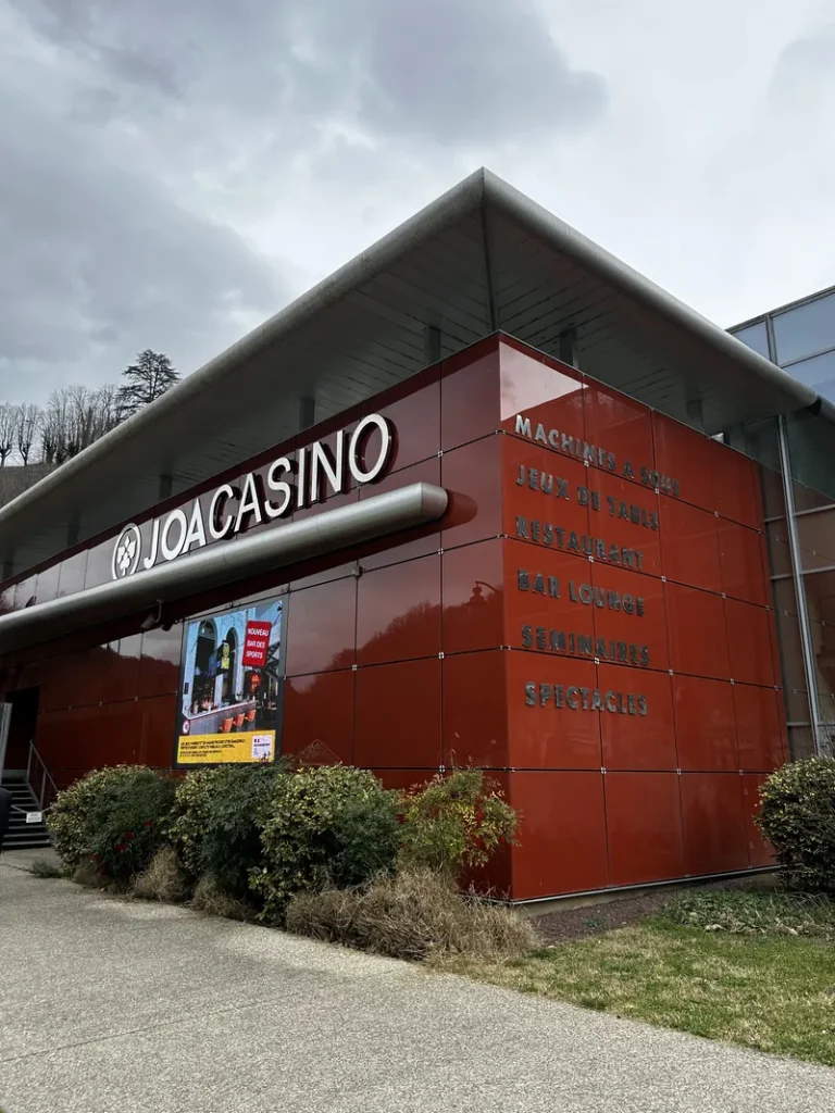Red exterior wall and casino sign at Casino JOA d'Uriage