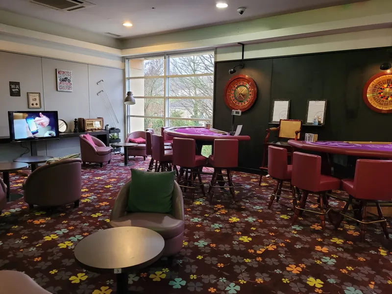 Gaming tables and lounge seating at Casino JOA de Bourbonne-les-Bains