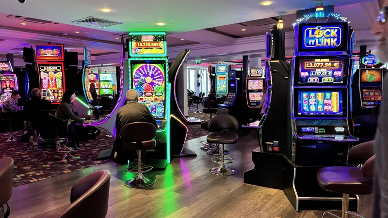 Slot machine room with purple lighting at Casino JOA de Châtelaillon