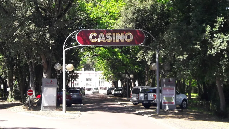 Arched casino gateway beneath the trees at Casino JOA de Fouras