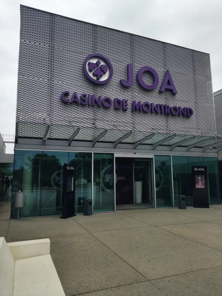 Glass entrance doors and signage at Casino JOA de Montrond-les-Bains