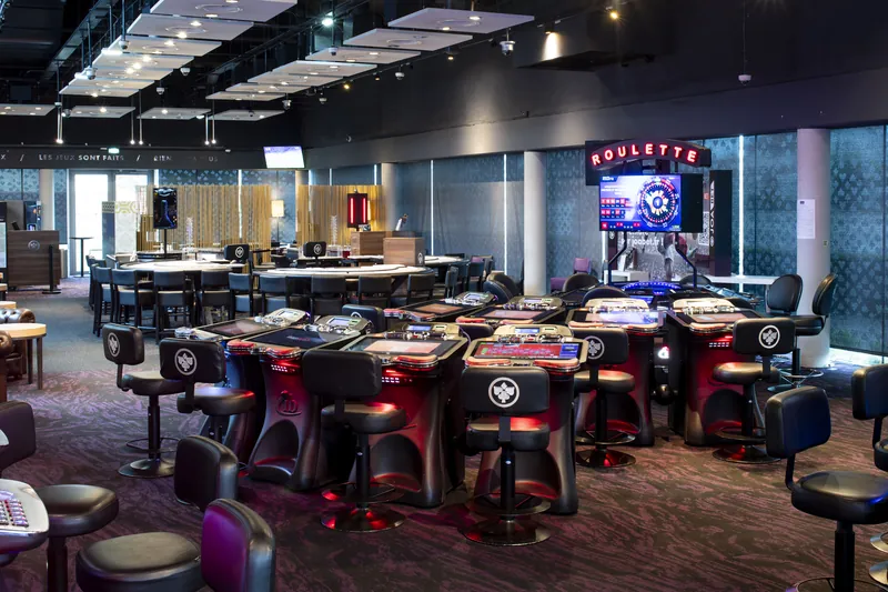 Gaming tables across the spacious floor at Casino JOA de Montrond-les-Bains