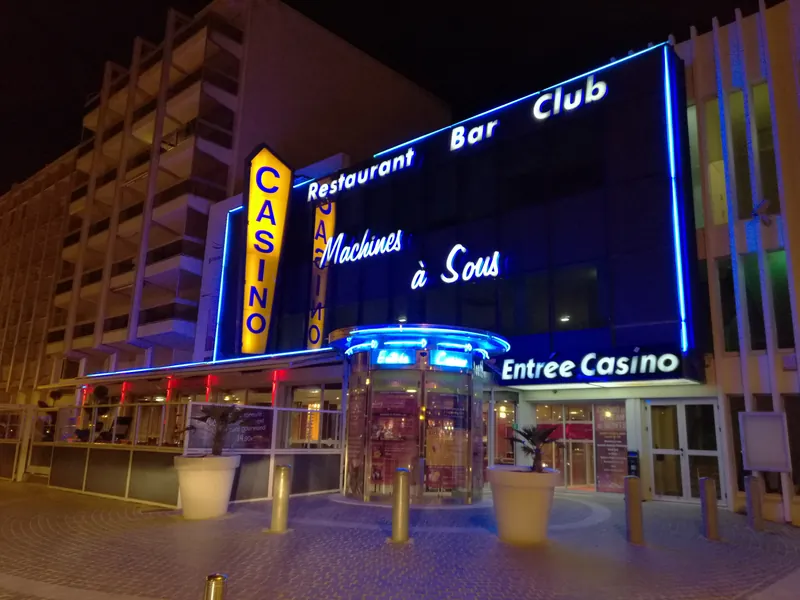 Vertical casino sign outside Casino JOA de Saint-Jean-de-Monts at night