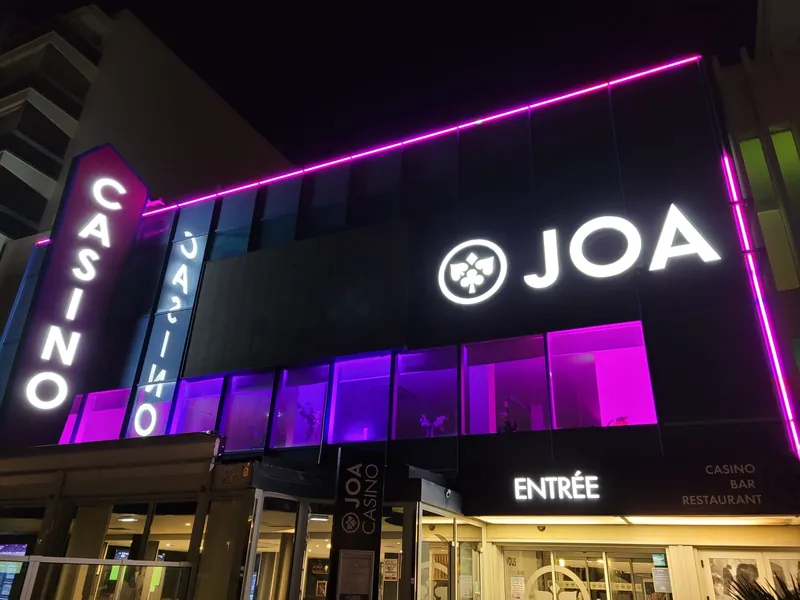 Purple-lit main entrance to Casino JOA de Saint-Jean-de-Monts at night