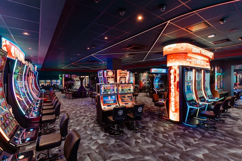 Orange-lit slot machines at Casino JOA de Saumur