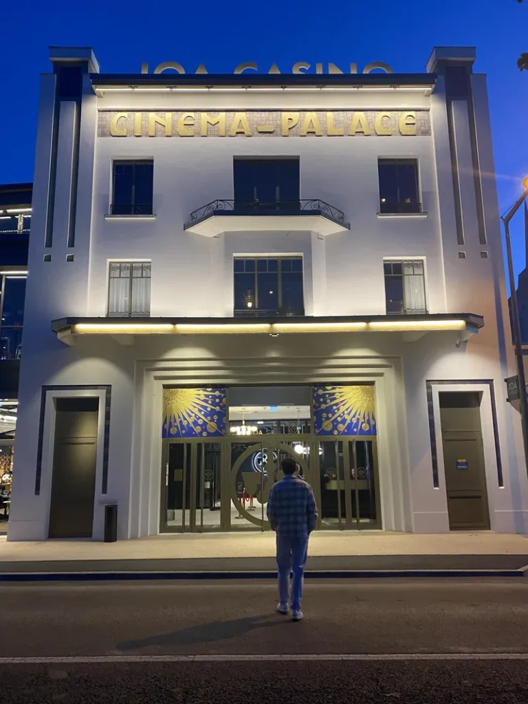 White front facade of Casino JOA de Saumur at night