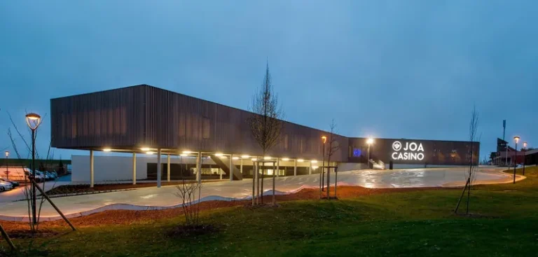 Modern casino building illuminated at dusk at Casino JOA du Lac du Der