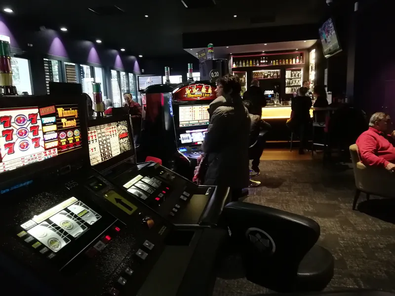 Dark slot machine area at Casino JOA Les Pins des Sables d'Olonne